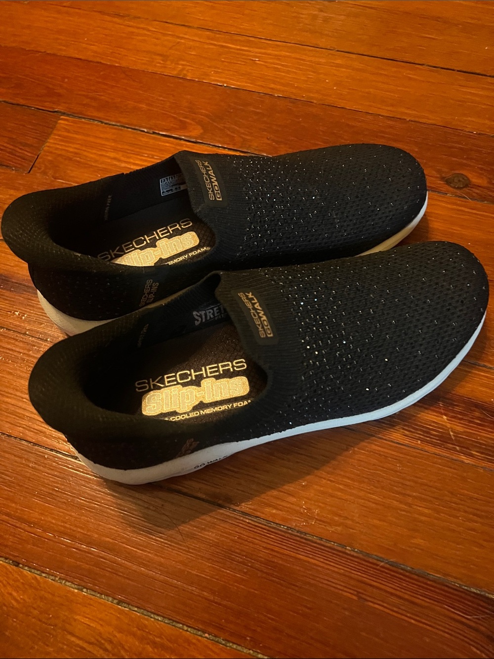 Skechers women’s sparkle Black Slip-On Knit Sneakers with White Sole